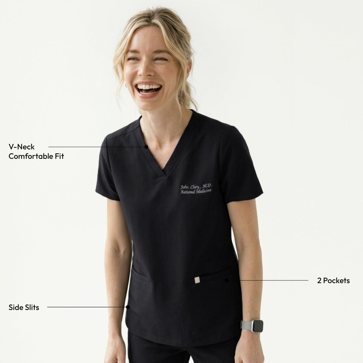 Woman wearing a black V-neck scrub top with embroidered name and side pockets, looking to the side,Eco Black