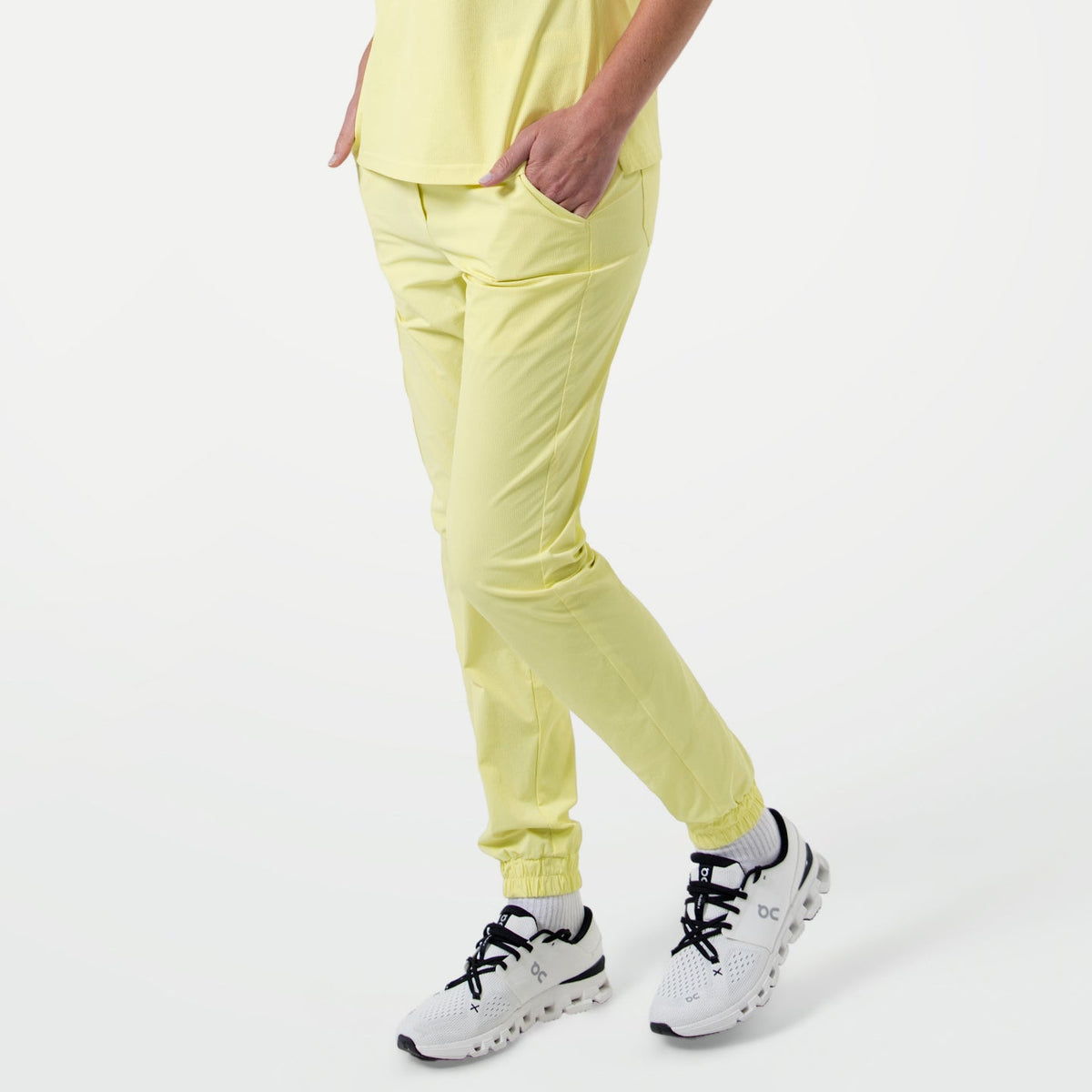 Pineapple Yellow StretchFit jogger scrub pants shown in a side-angled view