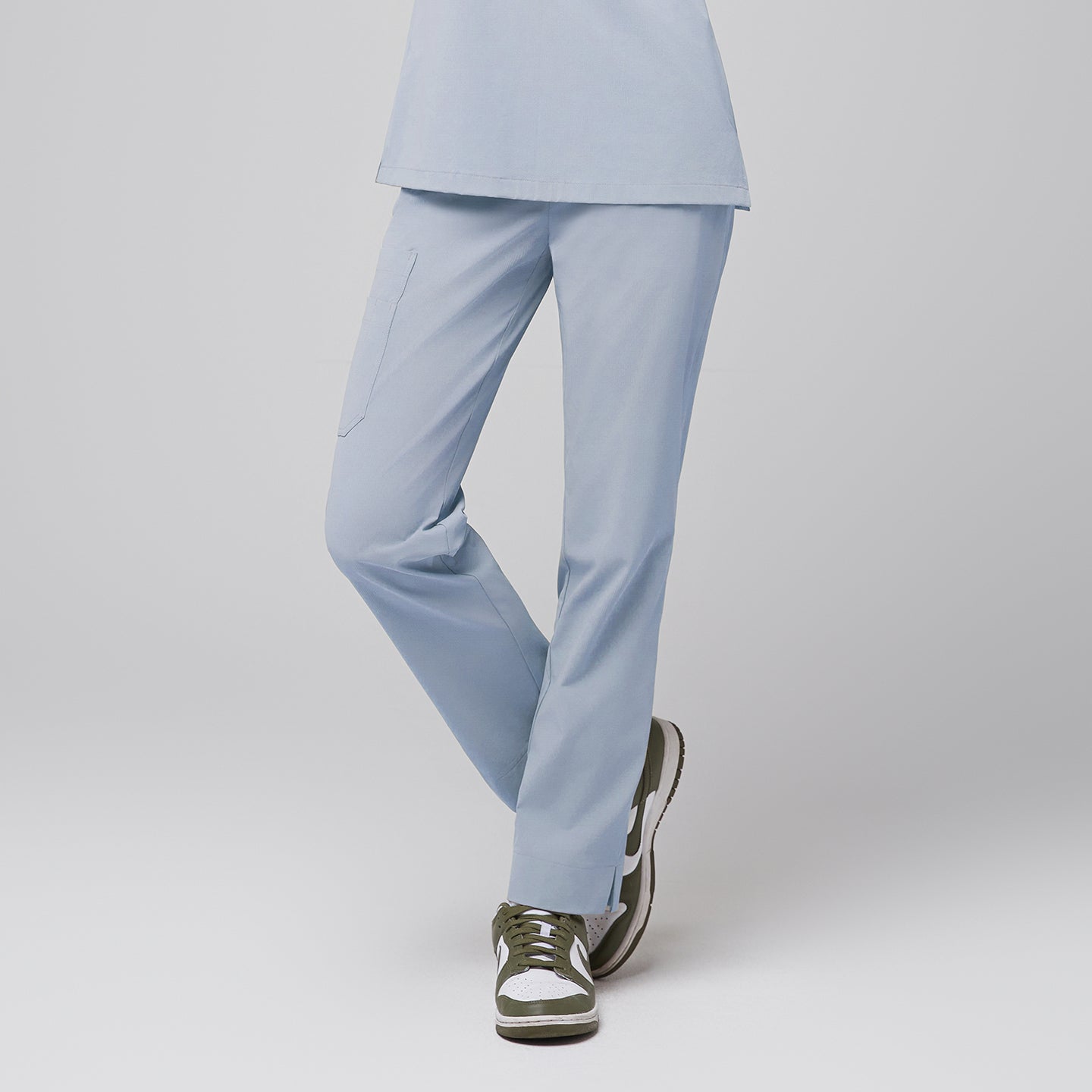 Cool gray scrub pants with pocket and split hem, paired with green and white sneakers,Cool Gray