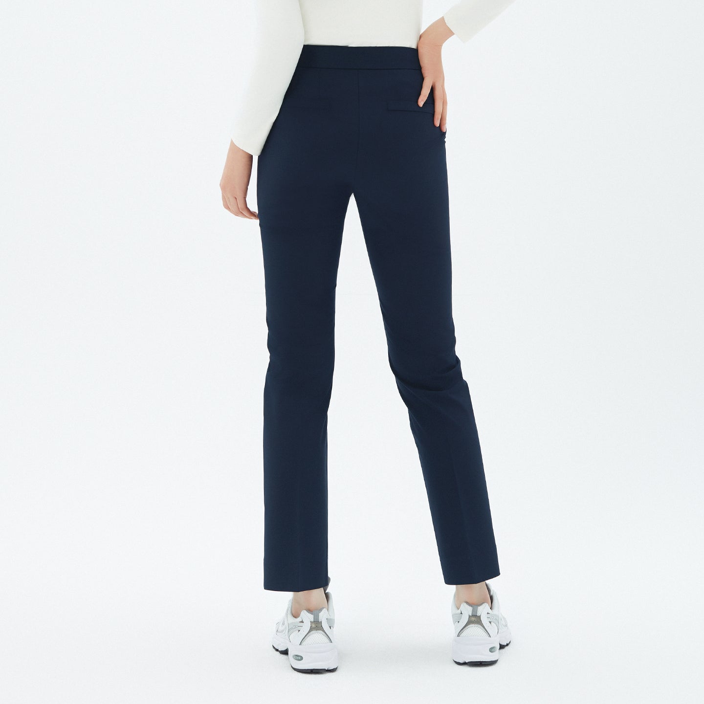 Back view of TUL Women’s Side Hidden Banding Pants in Mir Navy, emphasizing a streamlined silhouette and durable fabric.