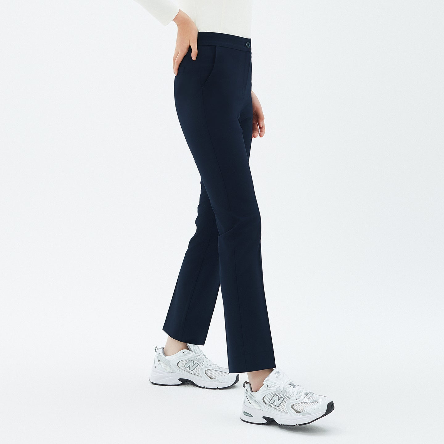 Side view of TUL Women’s Side Hidden Banding Pants in Mir Navy, showcasing the discreet elastic waistband and sleek, straight-leg fit.