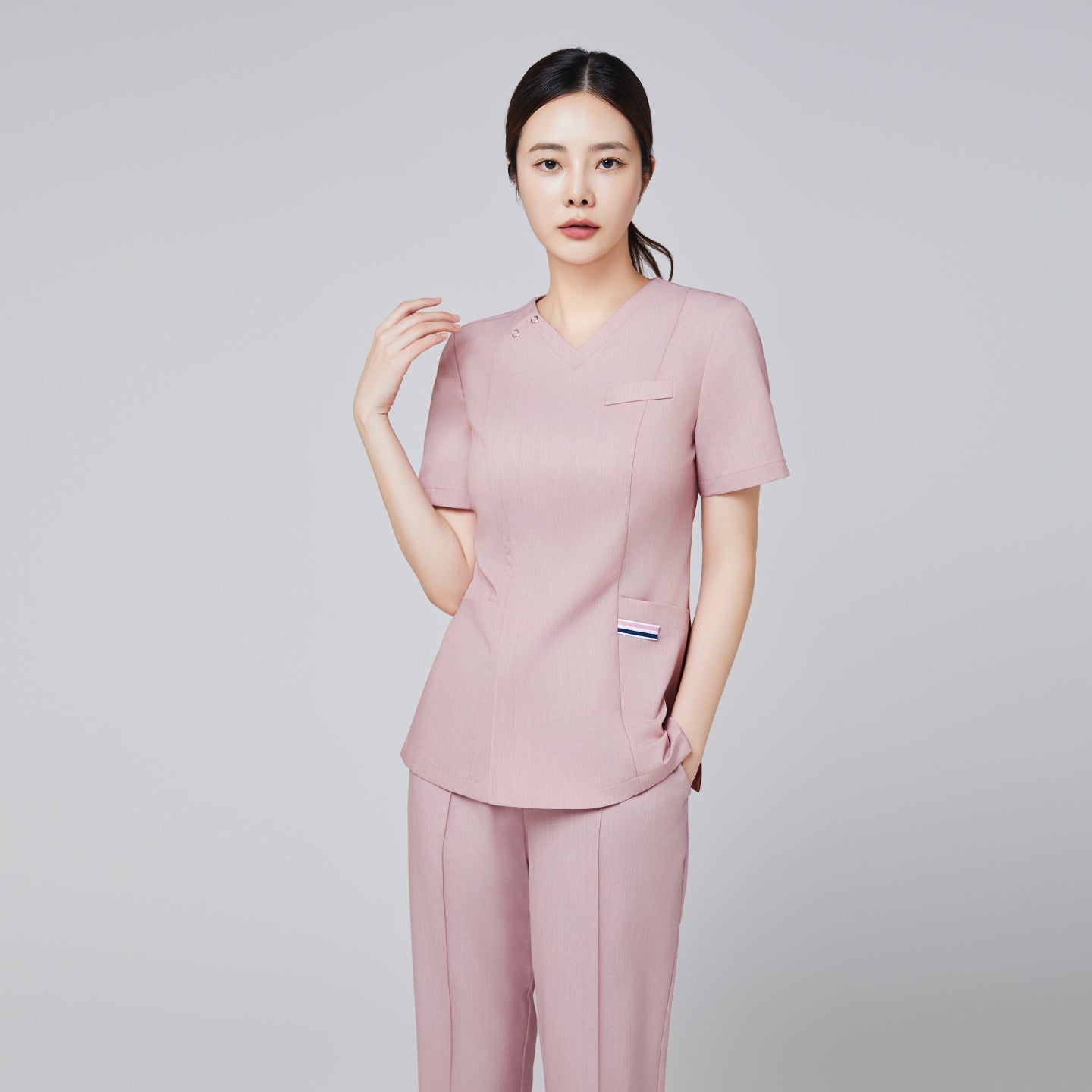 Soft pink V-neck scrub top with short sleeves and matching banding scrub pants, featuring a professional and elegant design,Soft Pink