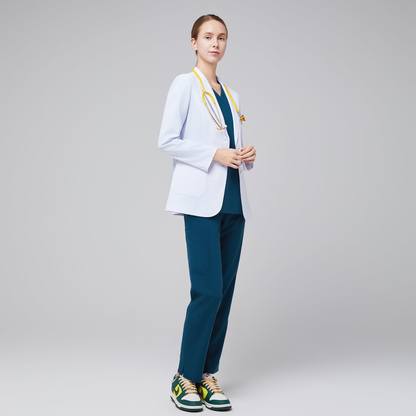 White lab coat LCW-02, full-side model shot with notched lapels and a clean two-button front.