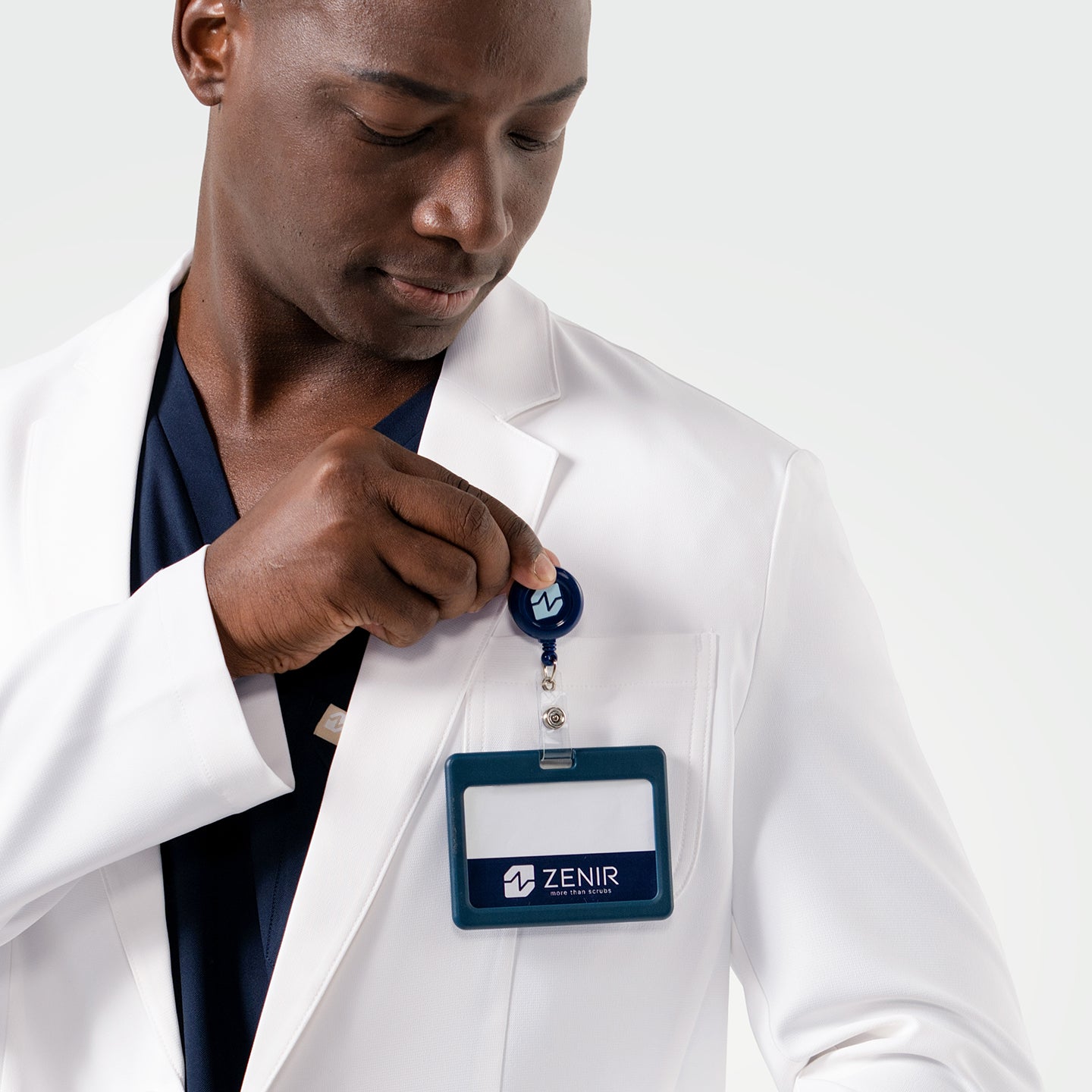 A closer look at the Men’s LCM-100 Lab Coat shows its practical chest pocket with an ID badge clip.