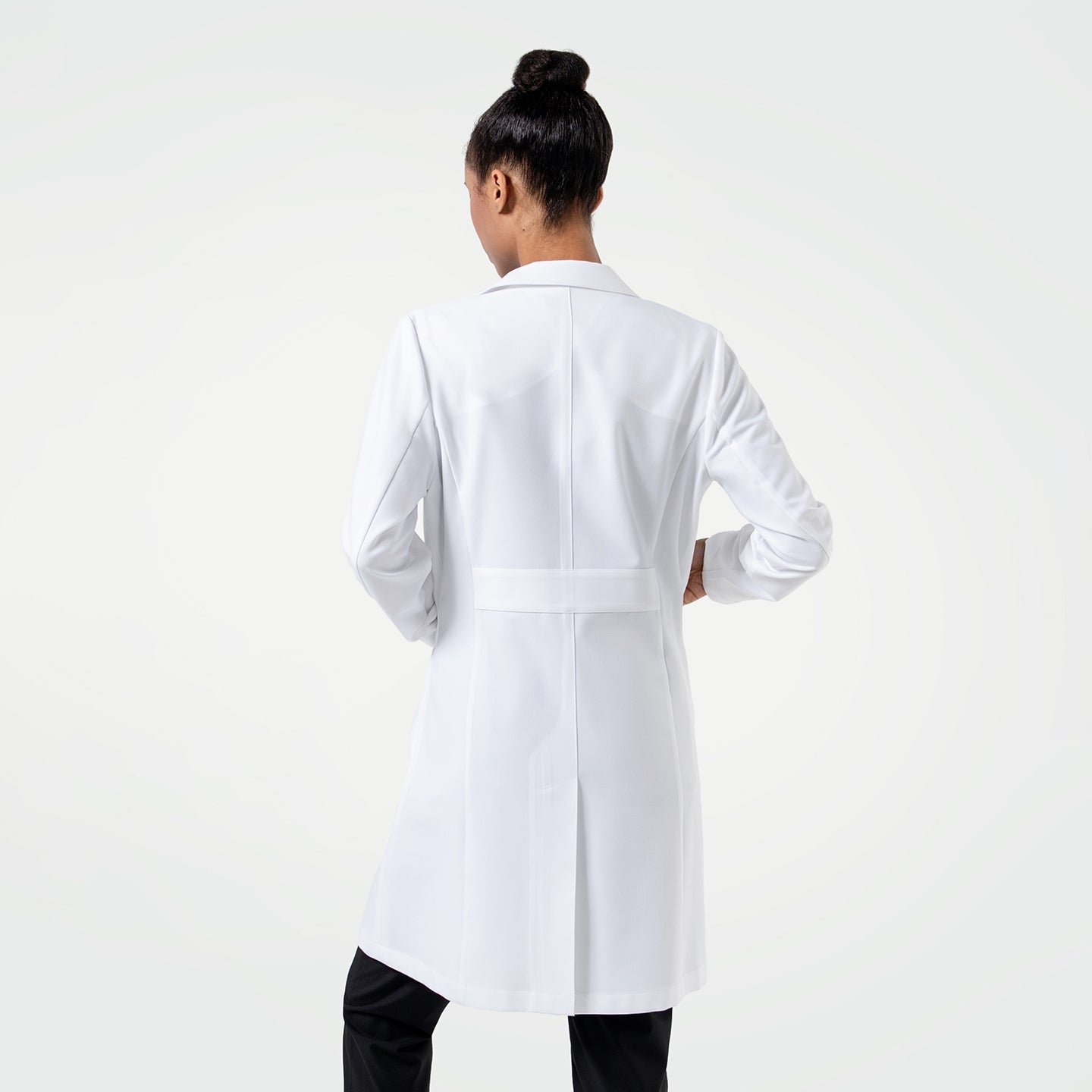 Full body back view, Woman wearing the Women's LCW-102 Lab Coat in White over medical scrubs