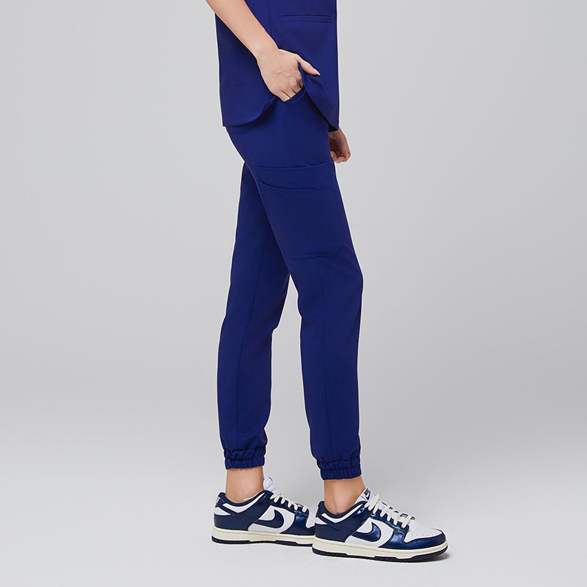 Admiral Blue StretchFit Jogger Scrub Pants with tapered jogger design, elastic cuffs, and side utility pocket, crafted from soft flexible fabric for medical professionals.