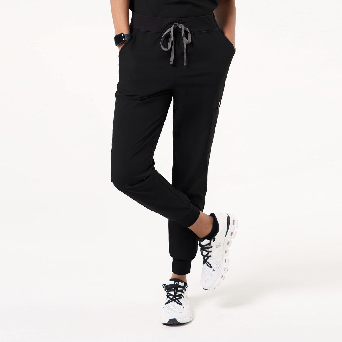 Side view of Eco-Black jogger scrub pants, highlighting the functional cargo pocket and fitted cuffed hem.