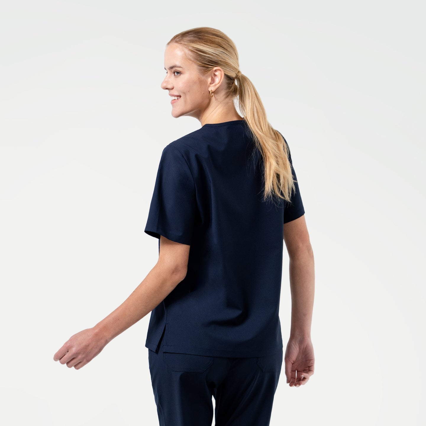 Back view of the Eco Navy scrub top with matching scrub pants for a polished professional style.