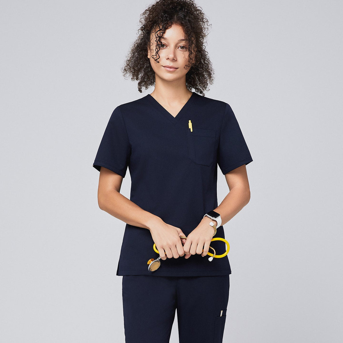 Scrub Top with classic V-neck and chest pocket design, offering a clean professional look and comfortable fit.