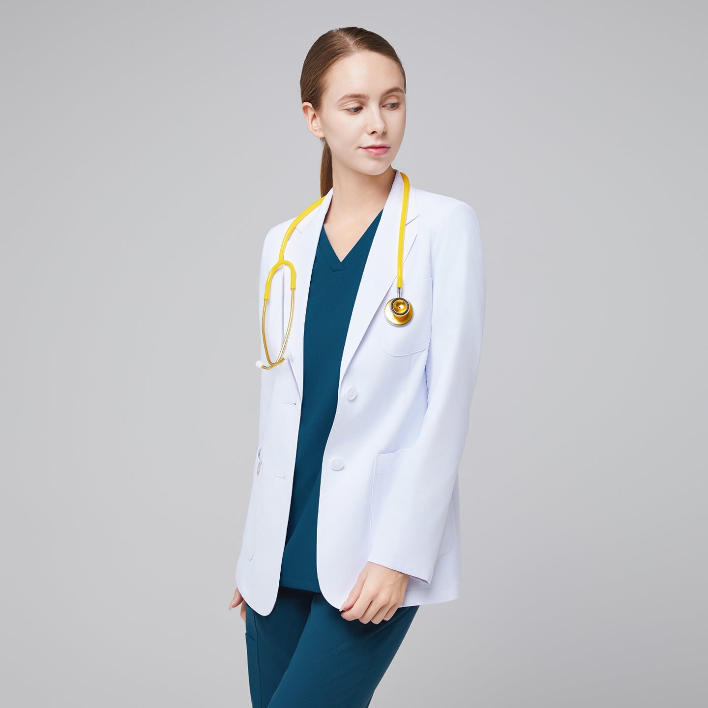 Sleek white lab coat Zenir, model wearing with notched lapels and front patch pockets, angled view.